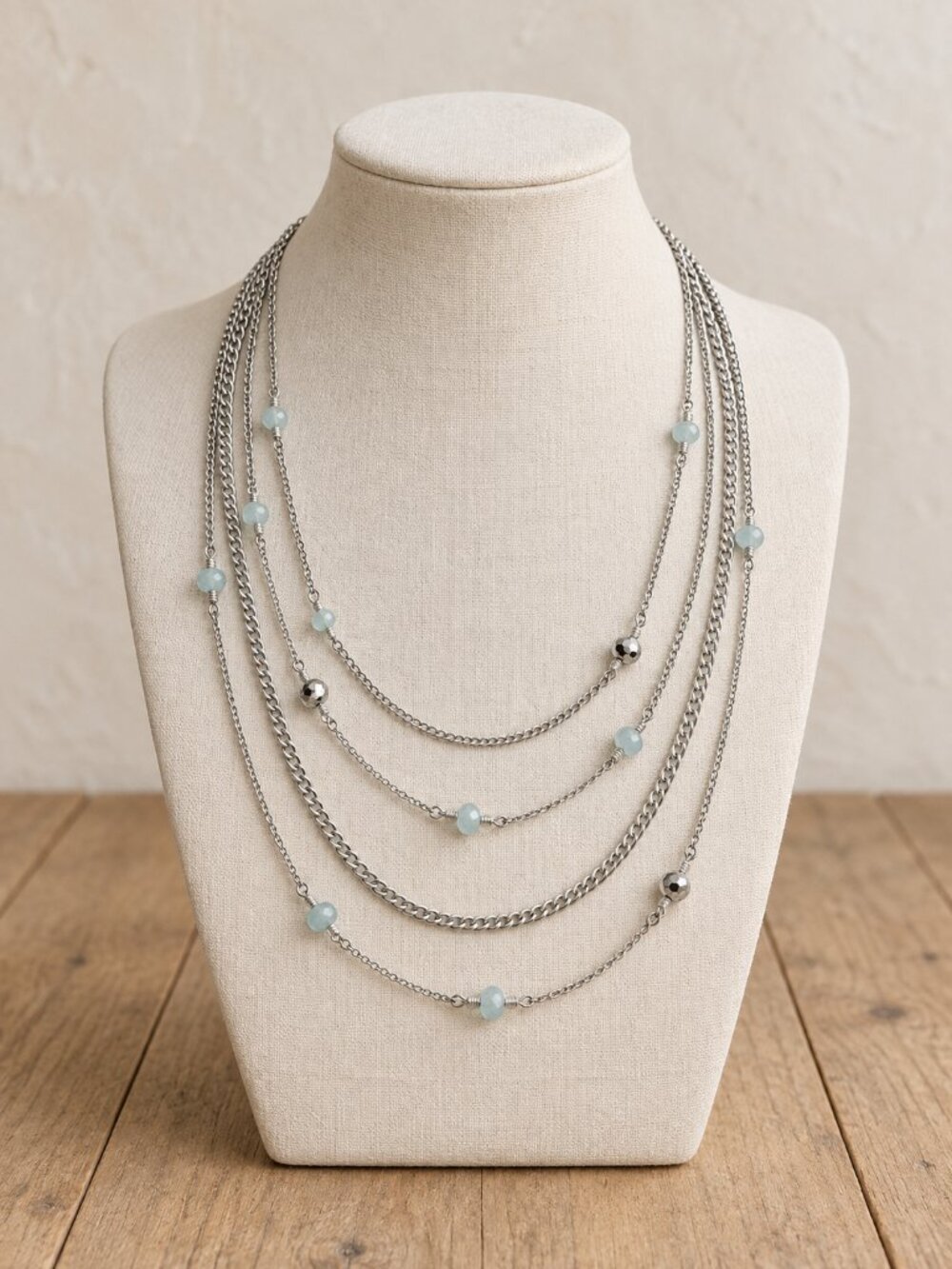 multi strand silver tone necklace with pale aqua beads